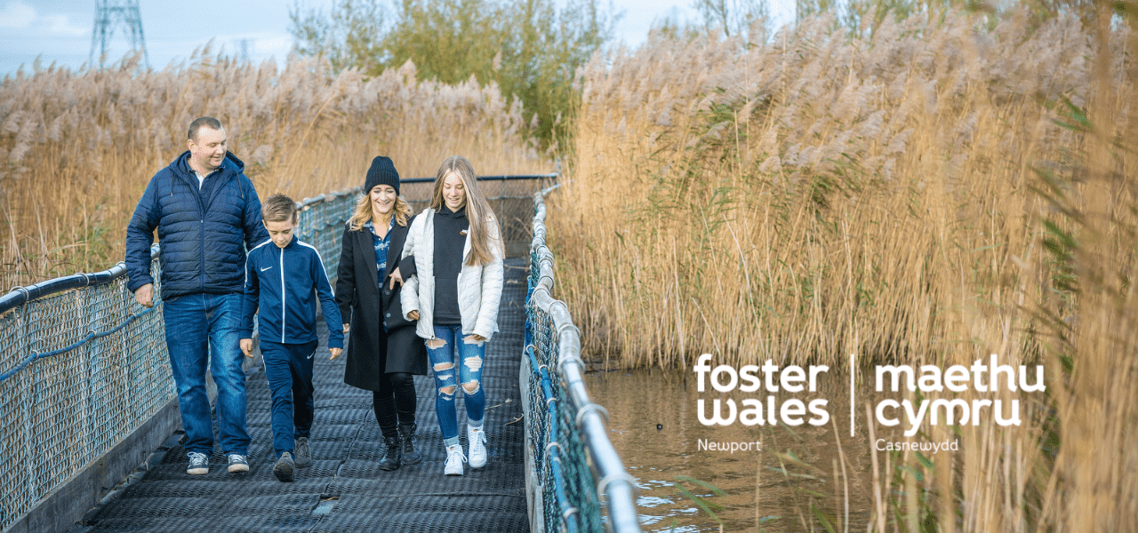 hero image of a family walking across a bridge