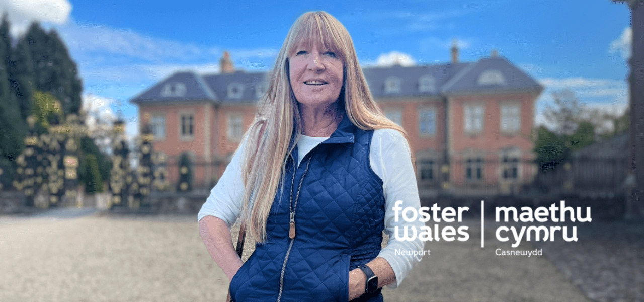 photo of angela outside with foster wales logo